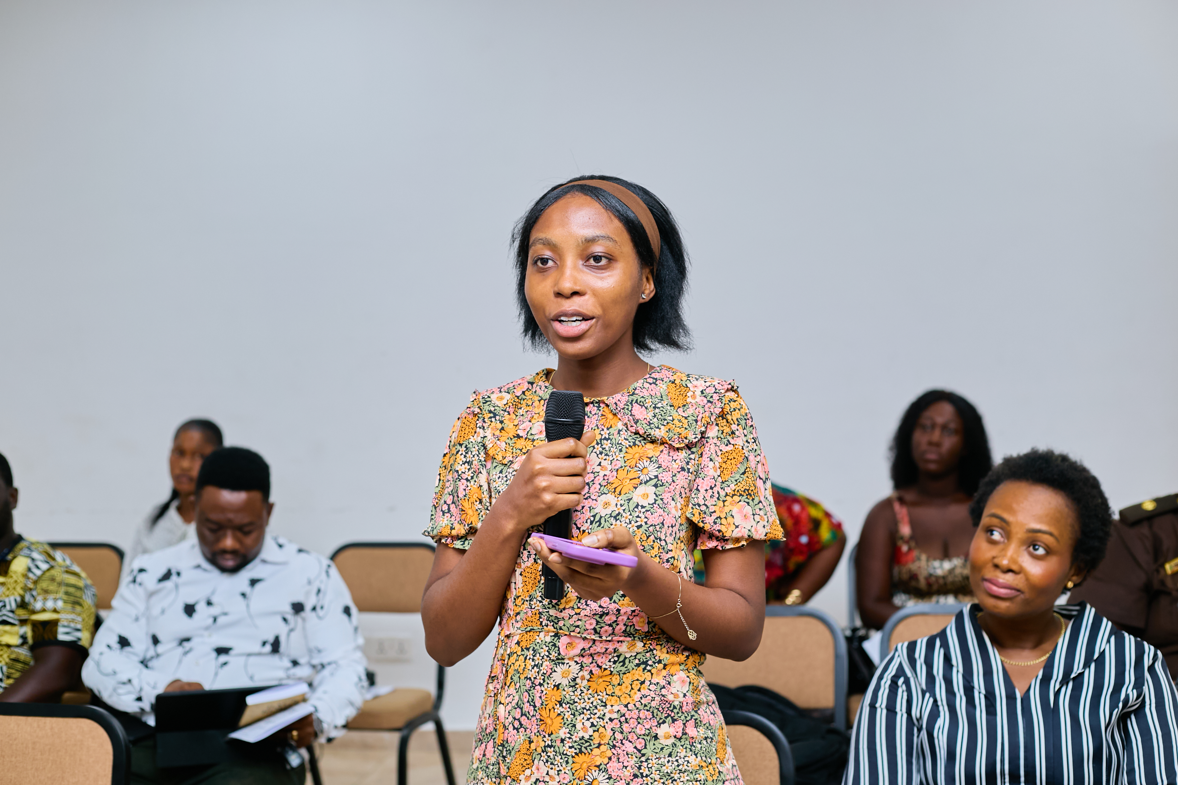 An audience member contributing to The Back Route launch conversation in Kumasi